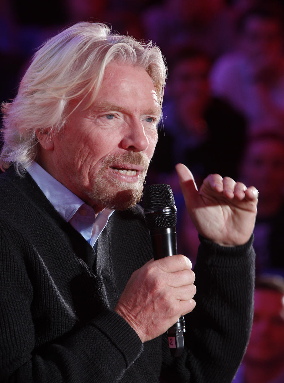 Virgin Group owner, British billionaire Richard Branson tells students packing a hall at Warsaw University that they need to be "passionate about whatever you are doing in life" to achieve success during a launch of Virgin Academy, a project to help young Poles start their businesses in Warsaw, Poland, on Wednesday, Oct. 24, 2012. (AP Photo/Czarek Sokolowski)