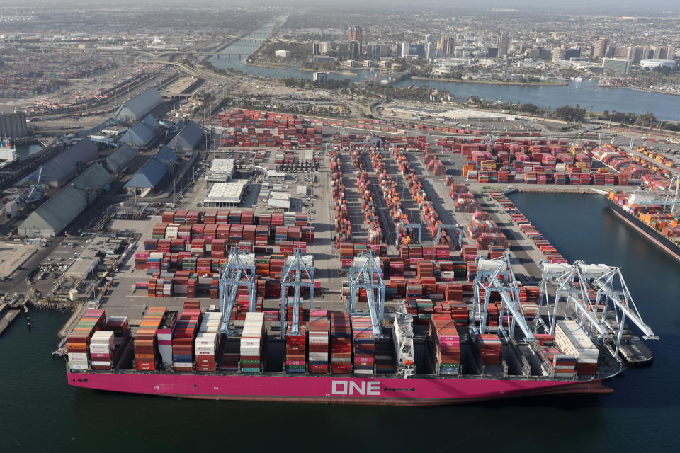 Shipping containers are unloaded from ships at a container terminal at the Port of Long Beach-Port of Los Angeles complex, amid the coronavirus disease (COVID-19) pandemic, in Los Angeles, California, U.S., April 7, 2021. REUTERS/Lucy Nicholson