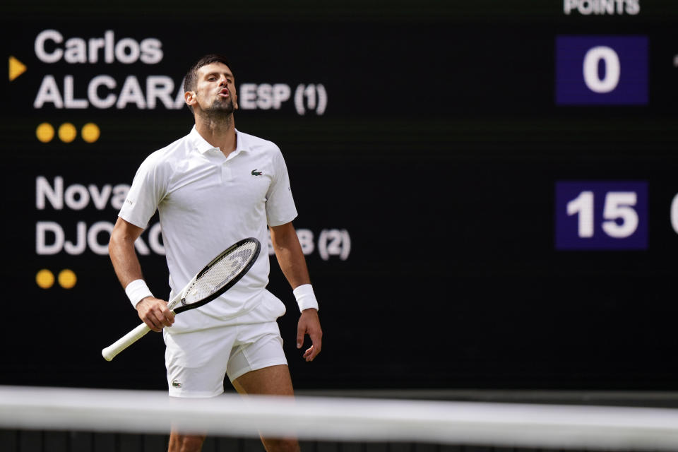 Serbia's Novak Djokovic in action against Spain's Carlos Alcaraz during the men's singles final on day fourteen of the Wimbledon tennis championships in London, Sunday, July 16, 2023. (AP Photo/Alberto Pezzali)