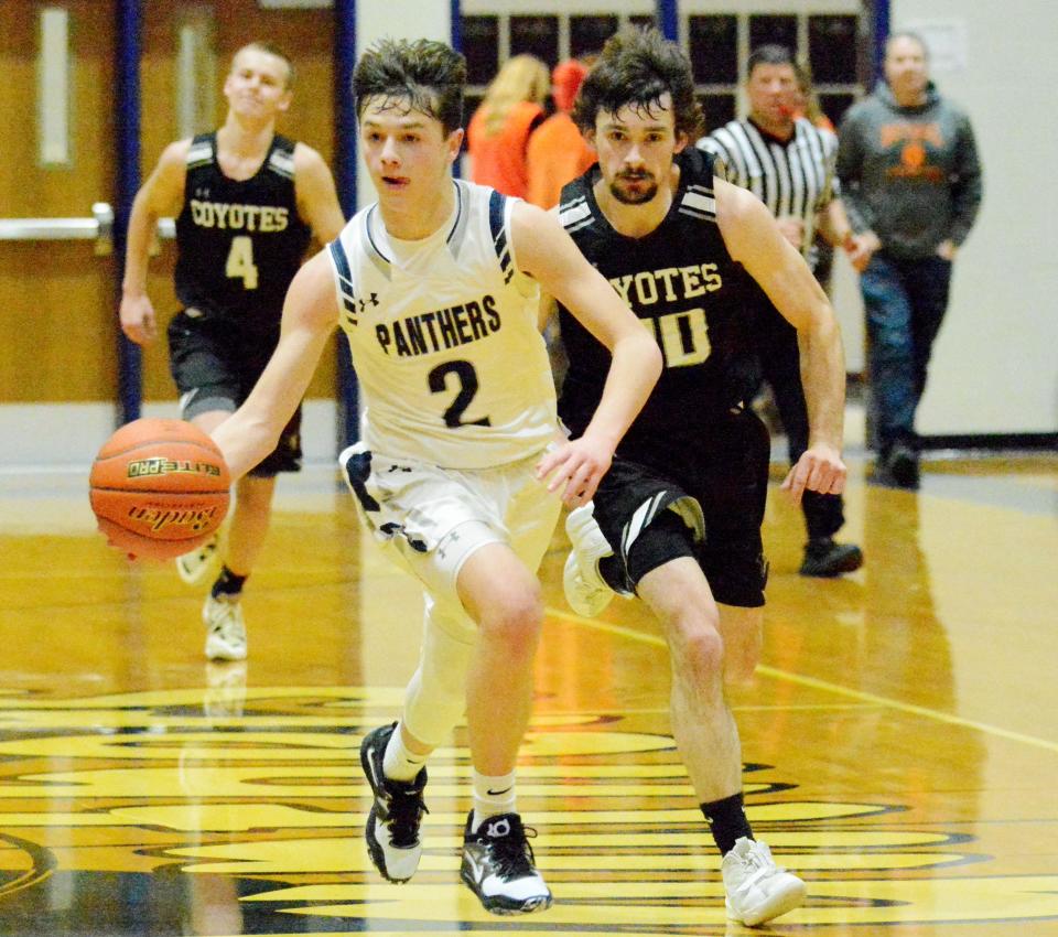 Great Plains Lutheran's Micah Holien (2) advances the ball against Waverly-South Shore's Evan Comes during a high school boys-girls basketball doubleheader on Thursday, Feb. 16, 2023 in Watertown.