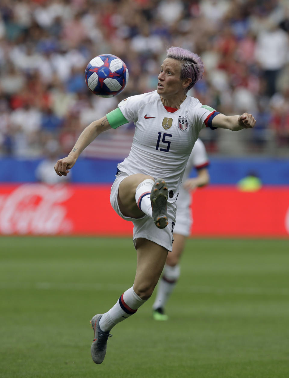 United States'Megan Rapinoe controls the ball during the Women's World Cup round of 16 soccer match between Spain and US at the Stade Auguste-Delaune in Reims, France, Monday, June 24, 2019. (AP Photo/Alessandra Tarantino)
