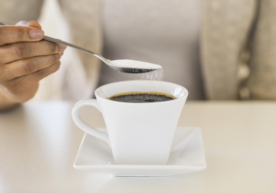 <p>We all know that adding sugar to anything sweet isn’t doing the best for our bodies. So try and resist that extra spoonful in your tea, coffee or cereal as most of these already have such a high sugar content. In fact, try cutting down on caffeine too to really see some effects. <i>[Photo: Getty]</i> </p>