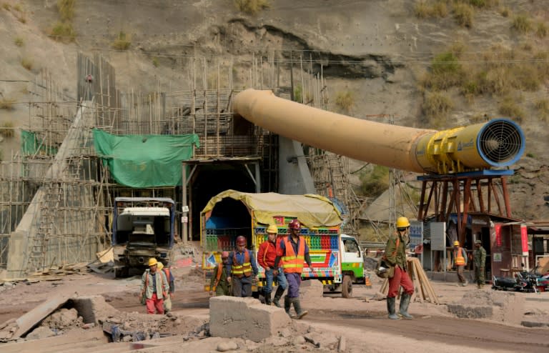 More than 6,000 Pakistani and Chinese workers busy themselves in the 28 kilometres (17 miles) of underground tunnels or in the power station itself, buried under 400 metres of rock in the heart of the Himalayas