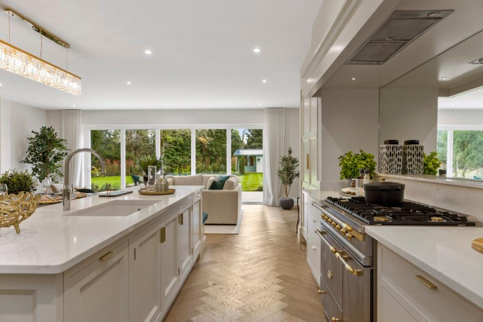 The Woodlands Collection in West Byfleet, Surrey, features upscale houses with hand-painted bespoke kitchens (Handout)