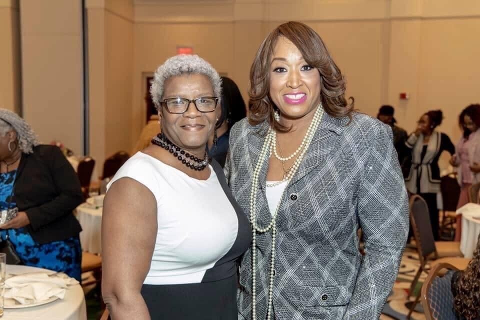 In this undated photo provided by Sherry Gay-Dagnogo, Michigan State Rep. Sherry Gay-Dagnogo, right, stands with her sister Julena Gay, left. Julena, 66, died April 14, 2020 of COVID-19 complications. Gay-Dagnogo said Detroit is experiencing a "collective loss" amid the pandemic. (Photo provided by Sherry Gay-Dagnogo via AP)