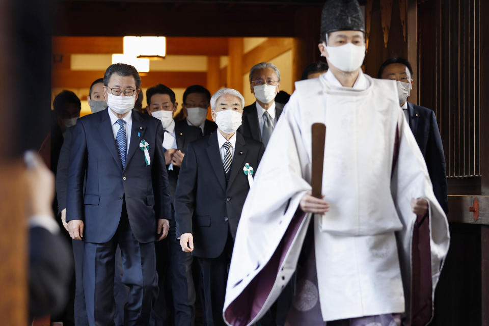 Japanese lawmakers visit the Yasukuni Shrine in Tokyo Tuesday, Dec. 7, 2021. A group of about 100 Japanese lawmakers prayed at the Tokyo shrine viewed by China and the Koreas as a symbol of Japanese wartime aggression on Tuesday, the eve of Japan’s Pearl Harbor attack 80 years ago. (Kenzaburo Fukuhara/Kyodo News via AP)