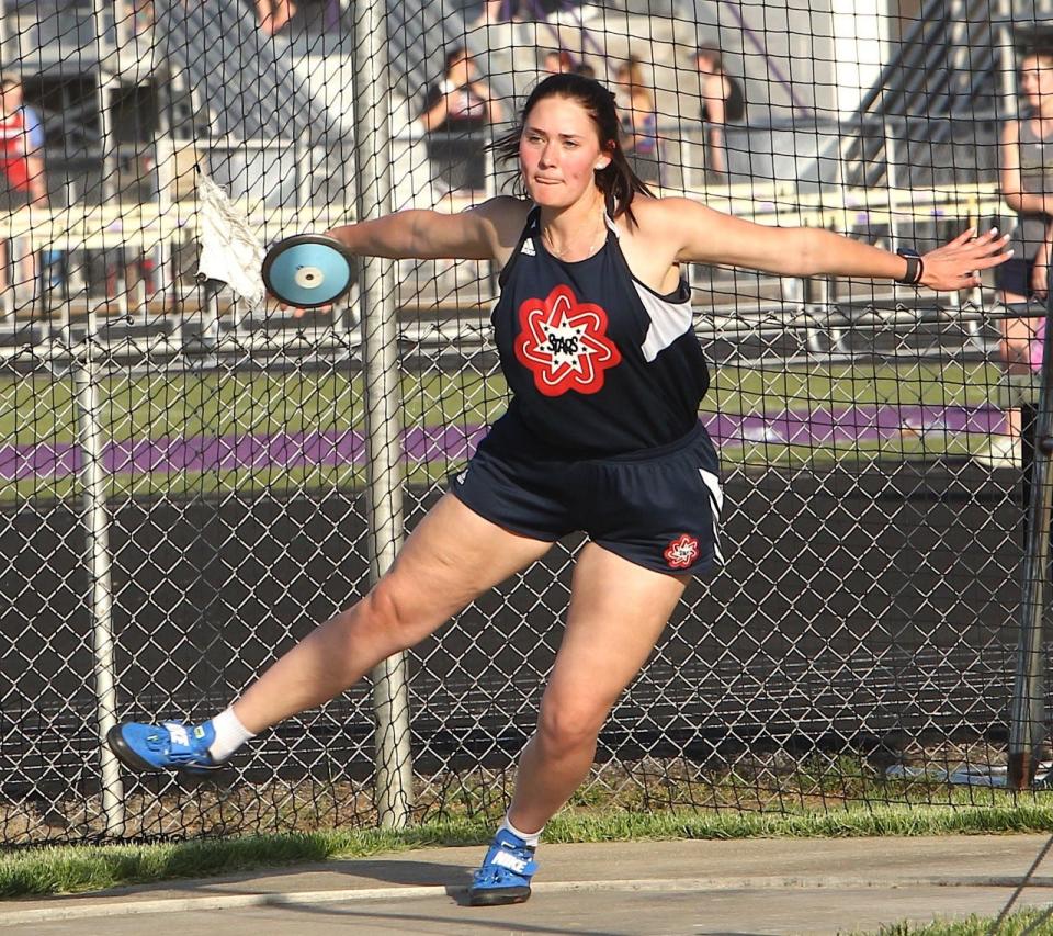 BNL senior Autumn Hall whirls into a sectional championship heave in the discus Tuesday night at the Seymour Sectional.