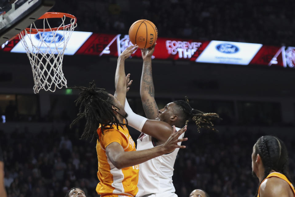 South Carolina forward B.J. Mack, right, shoots over Tennessee forward Jonas Aidoo during the first half of an NCAA college basketball game Wednesday, March 6, 2024, in Columbia, S.C. (AP Photo/Artie Walker Jr.)