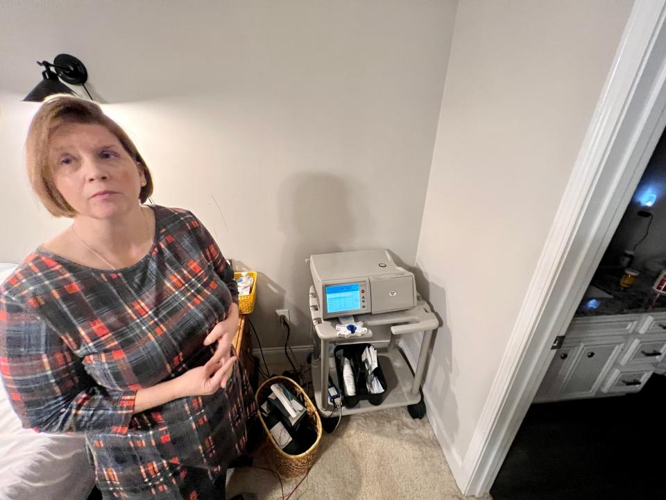 Michele Wilson uses a pump in her bedroom for dialysis treatments.