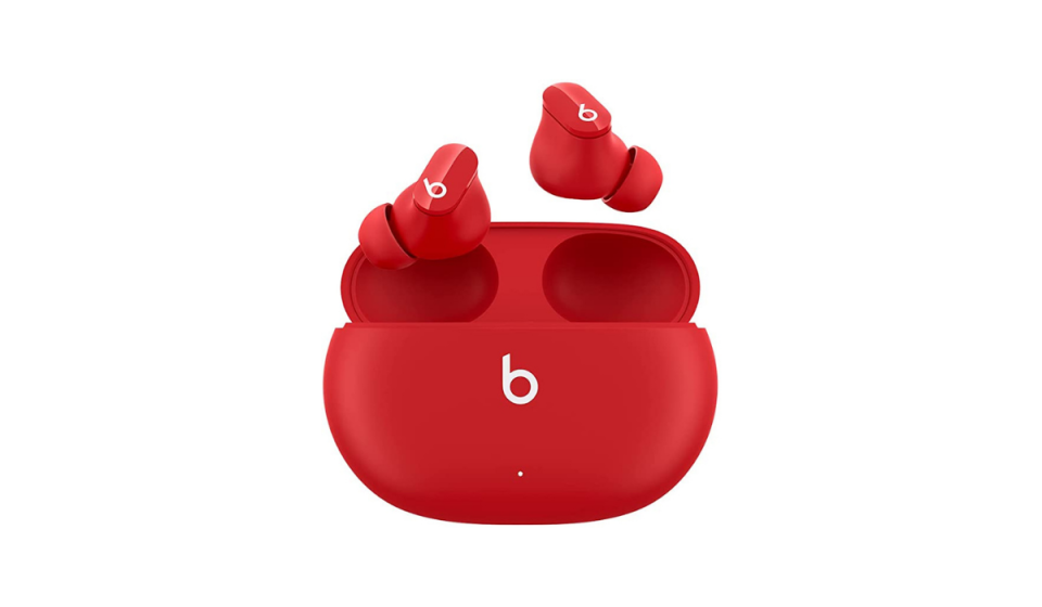 Red Beats earbuds with matching red wireless charging case. 