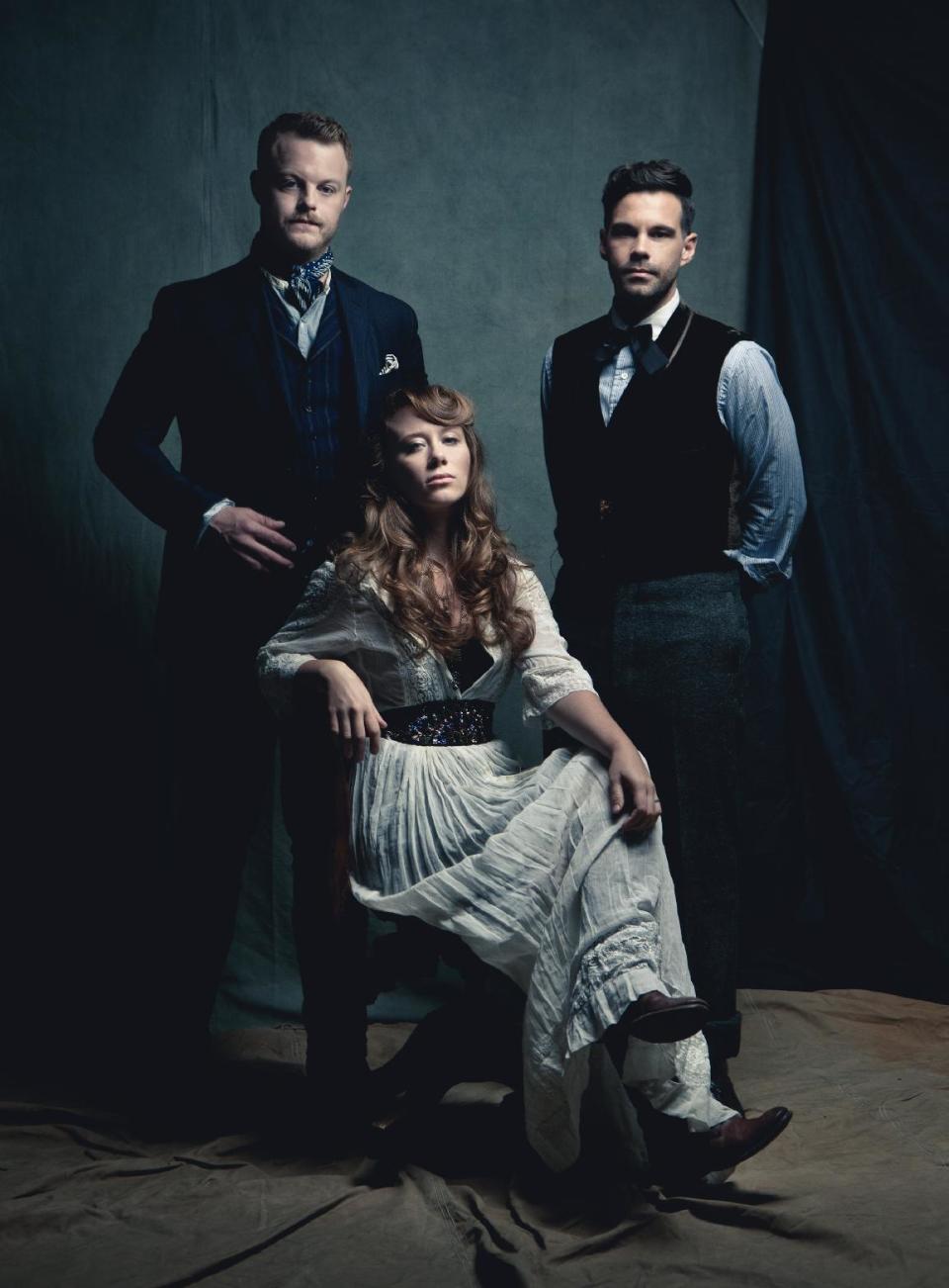 This publicity image released by Descendant Records shows members of The Lone Bellow, from left, Brian Elmquist, Kanene Pipkin, seated, and Zach Williams. (AP Photo/Descendant Records)