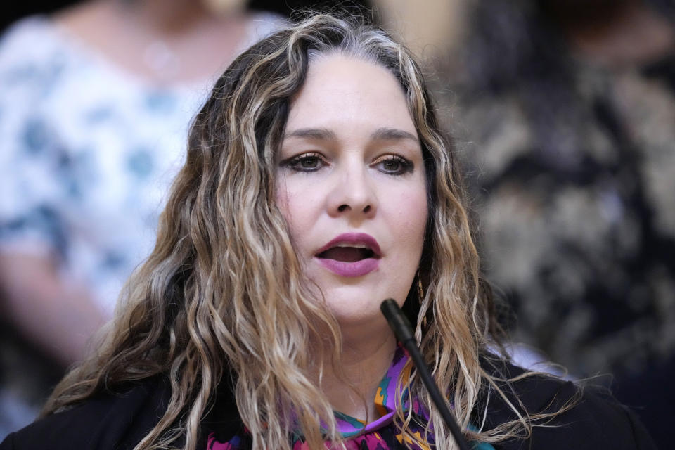 Emilee Shell, a former felon, speaks to reporters following a legislative hearing where a group of legislators were told about the difficulties that some former felons face in regaining their right to vote, Wednesday, April 17, 2024, at the Mississippi Capitol in Jackson. (AP Photo/Rogelio V. Solis)