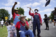 People participate in the March on Washington, Friday, Aug. 28, 2020, at the Lincoln Memorial in Washington, on the 57th anniversary of the Rev. Martin Luther King Jr.'s "I Have A Dream" speech. (AP Photo/Julio Cortez)