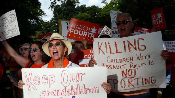 PHOTO: A group from Highland Park, Ill. hold signs at a rally at the U.S. Capitol, July 13, 2022 to call for stronger gun control measures including universal background checks and an assault weapons ban. (Josh Morgan/USA Today)