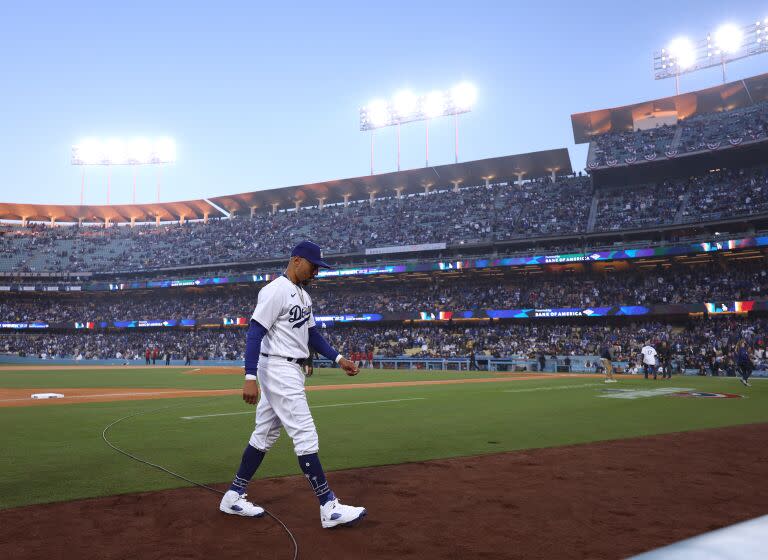 LOS ANGELES, CALIFORNIA - MARCH 30: Mookie Betts #50 of the Los Angeles Dodgers heads to the dugout.