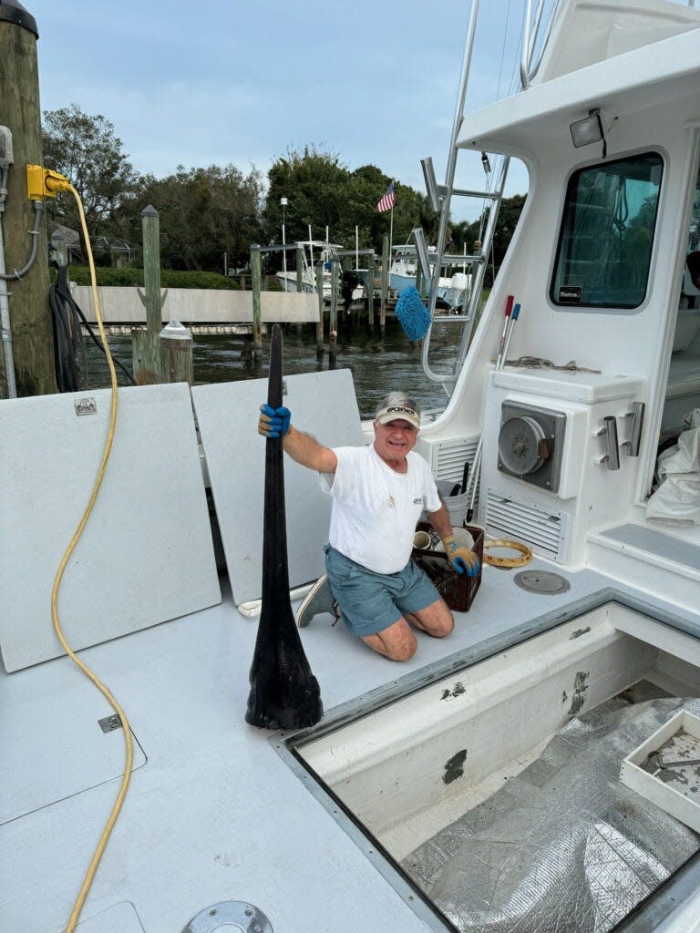 Bob Perimian of Rocky Point holds up the bill from a swordfish he caught Feb. 19, 2024. It was estimated to weigh 500 pounds or more.