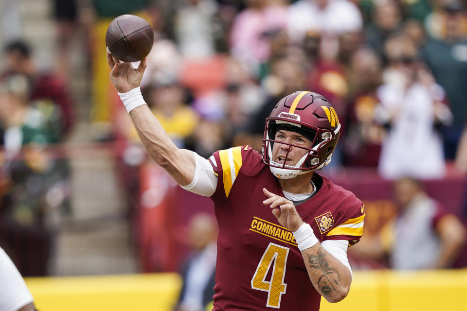 Washington Commanders quarterback Taylor Heinicke throws the ball during the first half of an NFL football game against the Green Bay Packers, Sunday, Oct. 23, 2022, in Landover, Md. (AP Photo/Susan Walsh)