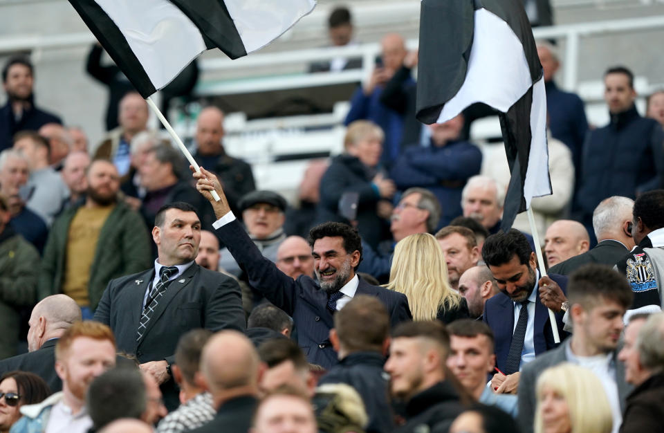 Newcastle United chairman Yasir Al-Rumayyan (center with flag) is also the governor of Saudi Arabia's Public Investment Fund. (Owen Humphreys/PA Images via Getty Images)