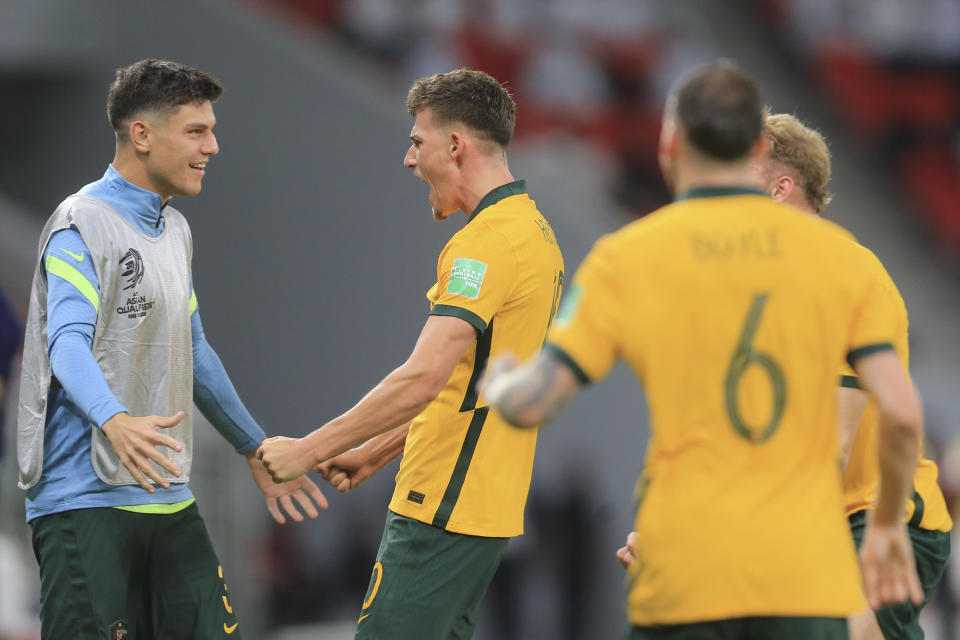 Australia's Ajdin Hrustic celebrates after a goal during a qualifying match between United Arab Emirates and Australia in Al Rayyan, Qatar, Tuesday, June 7 2022. (AP Photo/Hussein Sayed)