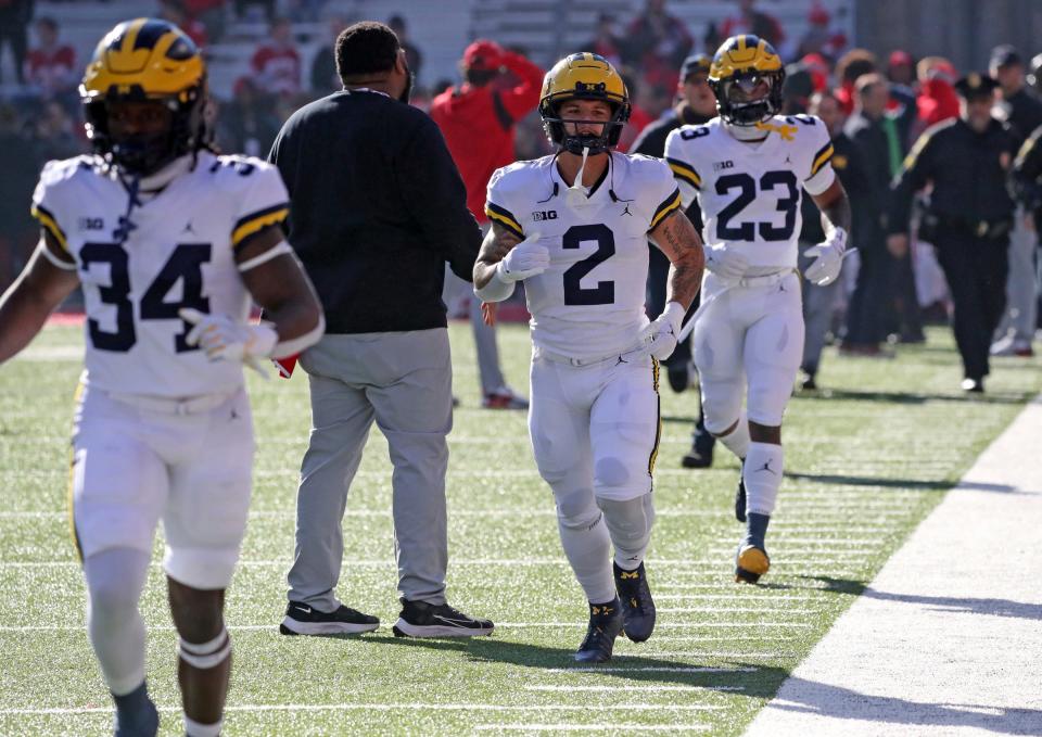 Michigan running back Blake Corum (2) takes the field with teammates Nov. 26, 2022 before the game vs. Ohio State at Ohio Stadium in Columbus.