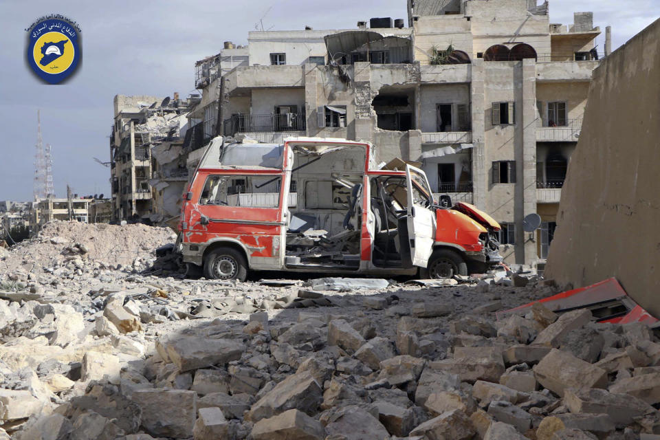 FILE - In this file photo provided by the Syrian Civil Defense group known as the White Helmets, taken Sept. 23, 2016, a destroyed ambulance is seen outside the Syrian Civil Defense main center after airstrikes in Ansari neighborhood in the rebel-held part of eastern Aleppo, Syria. A Syrian-led human rights group said Wednesday, Oct. 31, 2018 that it has documented more than 1,400 incidents in which Russian forces indiscriminately targeted civilians and civilian infrastructure in the three years since Moscow intervened in the civil war. (Syrian Civil Defense White Helmets via AP, File)