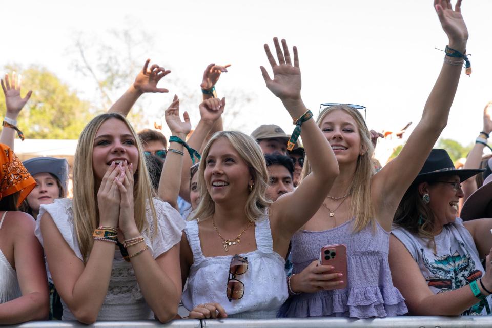 Fans cheer April 16 during the Two Step Inn at San Gabriel Park in Georgetown. Two stages at the fest were all country acts. A third, called Country Curious, programmed a mix from country's Niko Moon to T-Pain and Diplo.