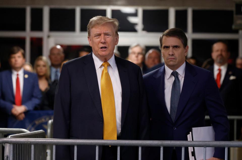 Former U.S. President Donald Trump speaks to members of the media before entering the courtroom with his attorney Todd Blanche (R) at Manhattan Criminal Court on May 21, 2024 in New York City. Trump was charged with 34 counts of falsifying business records last year, which prosecutors say was an effort to hide a potential sex scandal, both before and after the 2016 presidential election. Trump is the first former U.S. president to face trial on criminal charges.