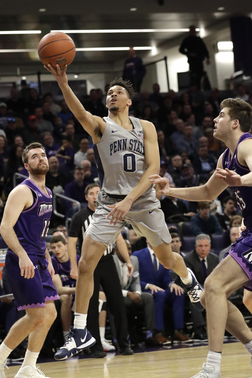 Penn State guard Myreon Jones (0) drives to the basket against Northwestern during the first half of an NCAA college basketball game in Evanston, Ill., Saturday, March 7, 2020. (AP Photo/Nam Y. Huh)