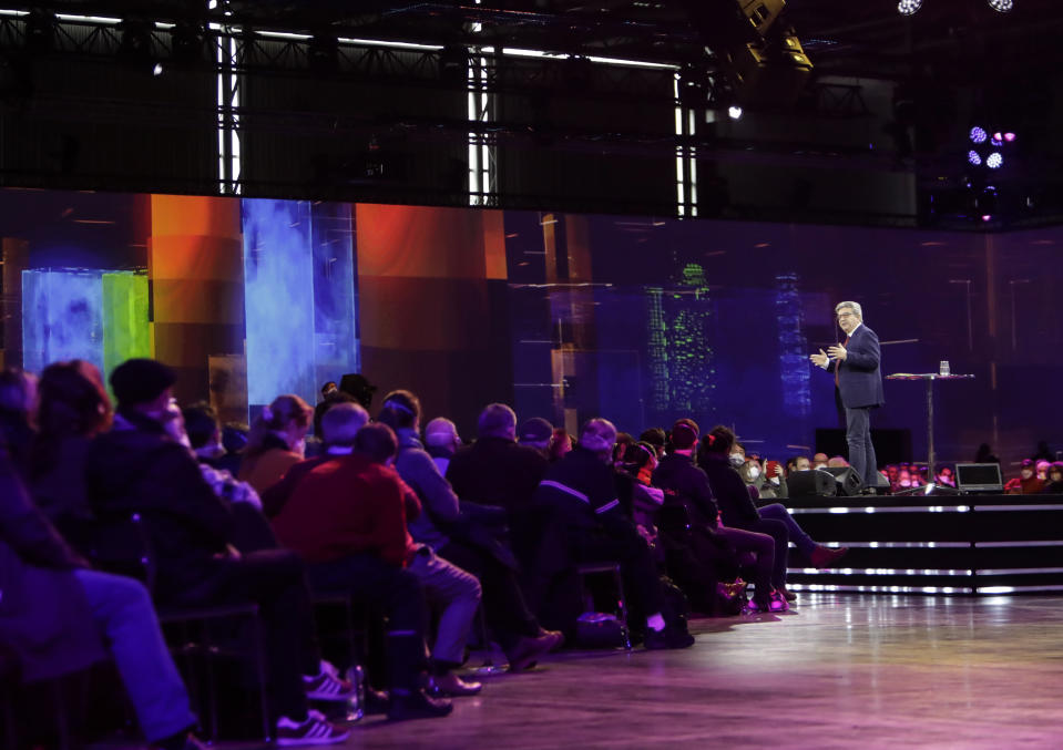 French Far-left presidential candidate for the 2022 election Jean-Luc Melenchon gestures as he speaks during a meeting in Nantes, western France, Sunday, Jan. 16, 2022. Far-left French presidential candidate Jean-Luc Melenchon sought Sunday to reinvigorate his flagging campaign for April's election with an "immersive and olfactory" rally, using 360-degree video and smells diffused through an exhibition hall in the western city of Nantes. (AP Photo/Jeremias Gonzalez)