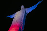 <p>The Christ the Redeemer statue is illuminated in red, blue and white, the colors of the flag of The United Kingdom, as a tribute to Queen Elizabeth II on her passing, in Rio de Janeiro, Brazil, Thursday, Sept. 8, 2022. Britain's longest-reigning monarch died Thursday after 70 years on the throne. She was 96. (AP Photo/Bruna Prado)</p> 