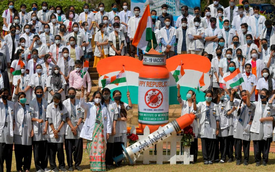 Students and staff of a medical college take part in an awareness campaign for the Covid-19 coronavirus vaccination on the eve of Indias Republic Day in Bangalore -  MANJUNATH KIRAN AFP