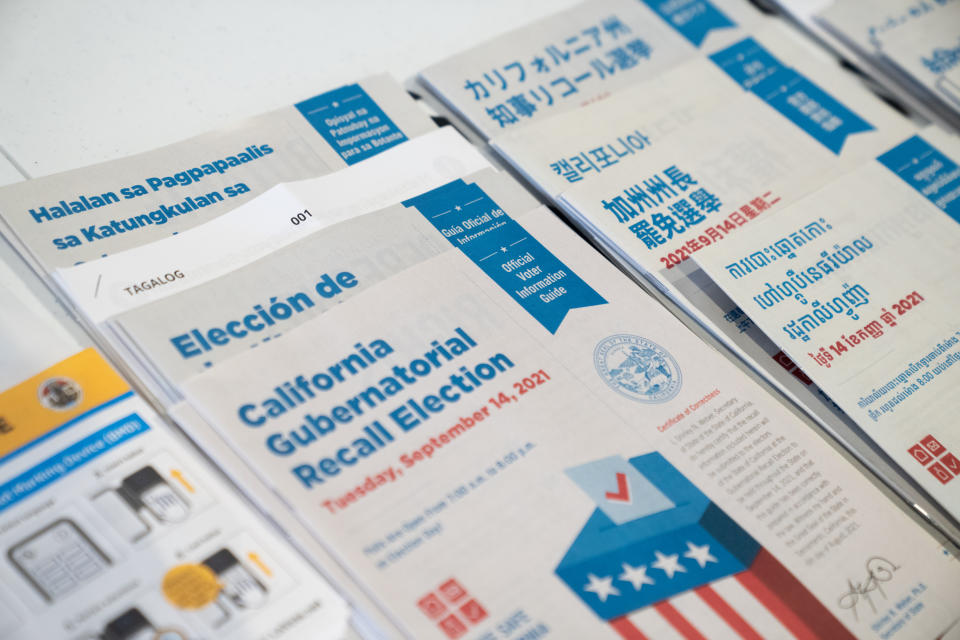 Voter information guides in English and Spanish at a Long Beach polling station during the California gubernatorial recall election in 2021.