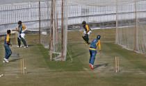 Pakistan player Babar Azam, top right, and Abid Ali, second left, bat during a practice session at the Pindi Cricket Stadium, in Rawalpindi, Pakistan, Thursday, Oct. 29, 2020. The Zimbabwe cricket team is in Pakistan to play three ODIs and three Twenty20 International match series, beginning with the first ODI on Friday. (AP Photo/Anjum Naveed)