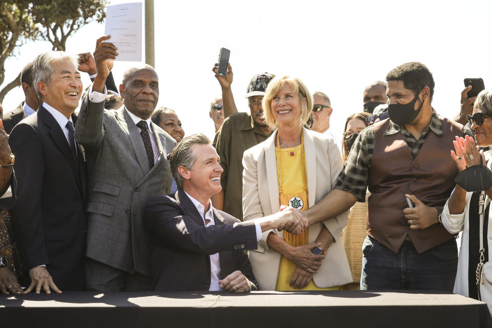 Gov. Gavin Newsom shakes hands with Anthony Bruce