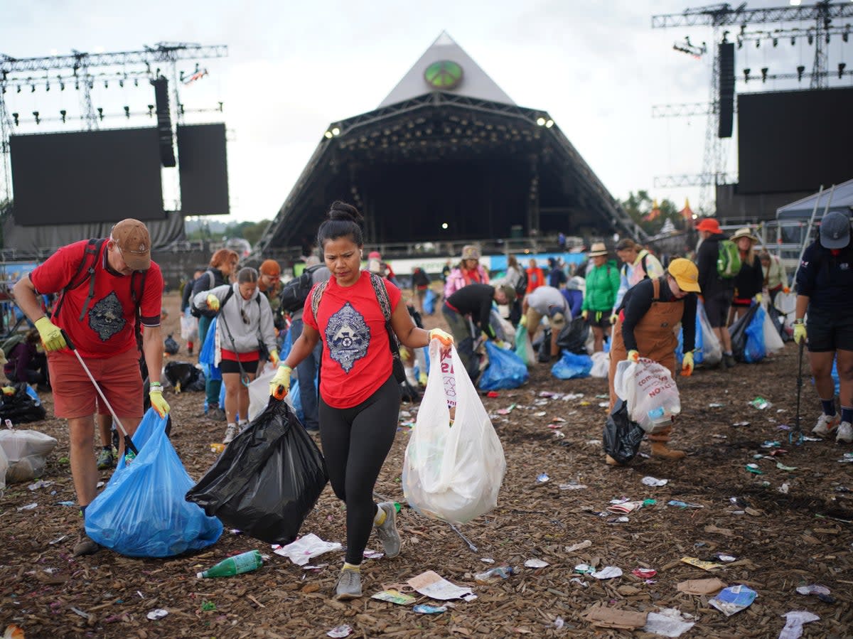 The Glastonbury 2023 site clean-up operation in progress (PA)