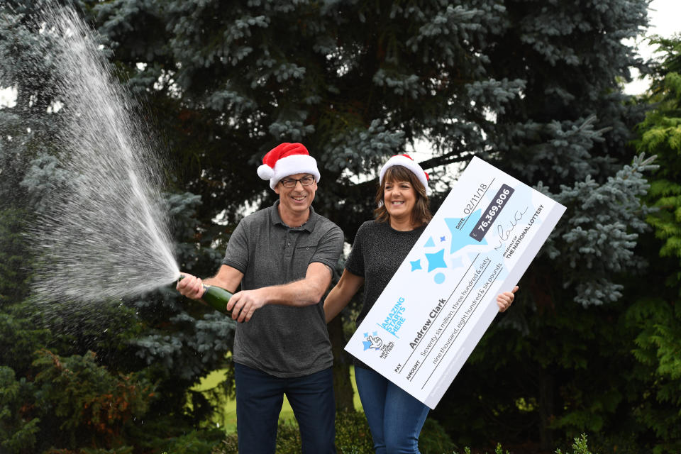 Andrew Clark and his partner Trisha Fairhurst celebrate their mammoth EuroMillions win. (PA)