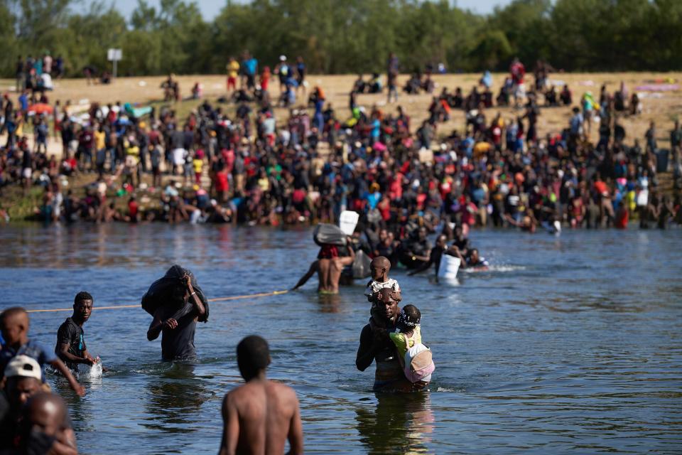 Thousands of migrants, many of them Haitian, illegally cross back and forth between the US and Mexico, as they remain camped under a bridge in Del Rio, Texas, USA, 20 September 2021. More than 14,000