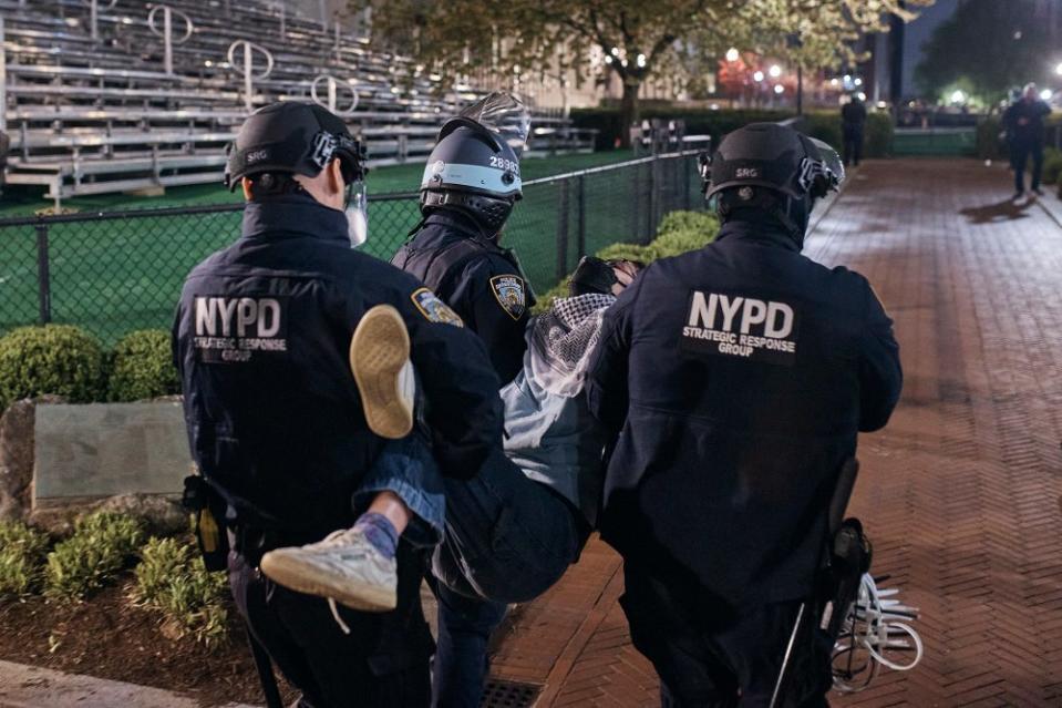 Police carry an arrested protestor at Columbia University.<span class="copyright">Andres Kudacki for TIME</span>