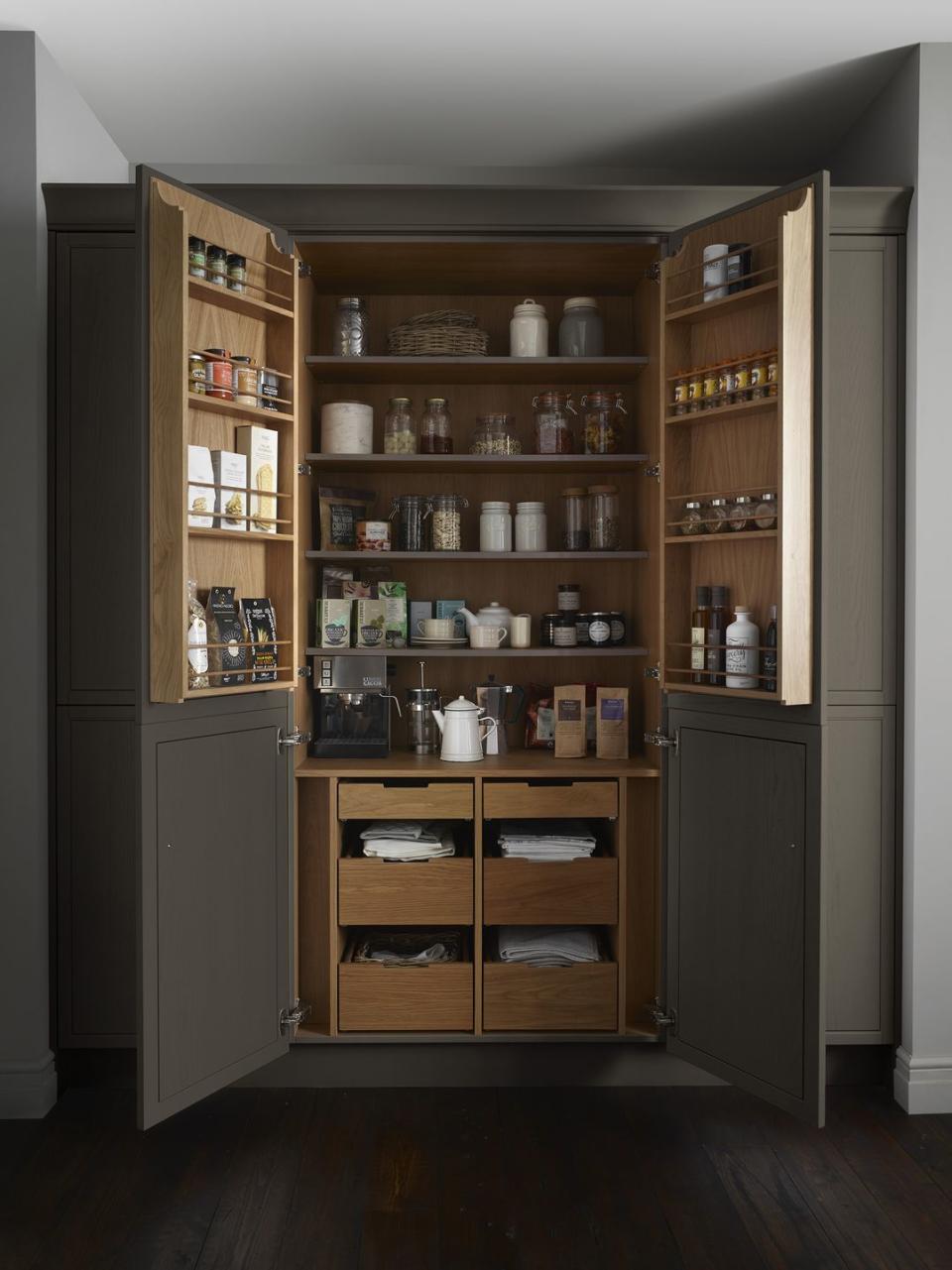 <p>The inside storage of this pantry is incredibly functional for neatly storing produce and dry goods. The wooden shelves are smart and the dark paint on the outside helps to blend in seamlessly with the rest of the kitchen. <strong><br></strong></p><p><strong>SEE MORE</strong>: <a href="https://www.housebeautiful.com/uk/garden/a26363330/organic-food-insect-decline/" rel="nofollow noopener" target="_blank" data-ylk="slk:Buying organic food can help with insect decline;elm:context_link;itc:0;sec:content-canvas" class="link ">Buying organic food can help with insect decline </a></p><p>• Shop the look at <a href="http://www.lauraashleykitchencollection.co.uk/ranges/harbury" rel="nofollow noopener" target="_blank" data-ylk="slk:Laura Ashley Kitchens;elm:context_link;itc:0;sec:content-canvas" class="link ">Laura Ashley Kitchens </a></p>