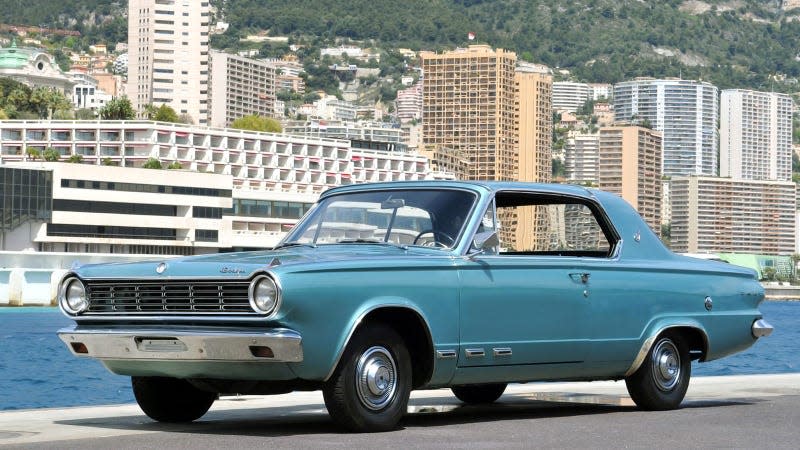 A photo of a pale blue Dodge Dart. 