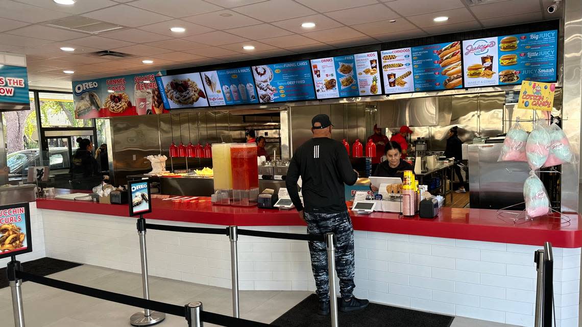 A customer steps up to order 11/29/2023 at Juicys​ Famous Fair Food, 2319 Cortez Road W., Bradenton. James A. Jones Jr./jajones1@bradenton.com