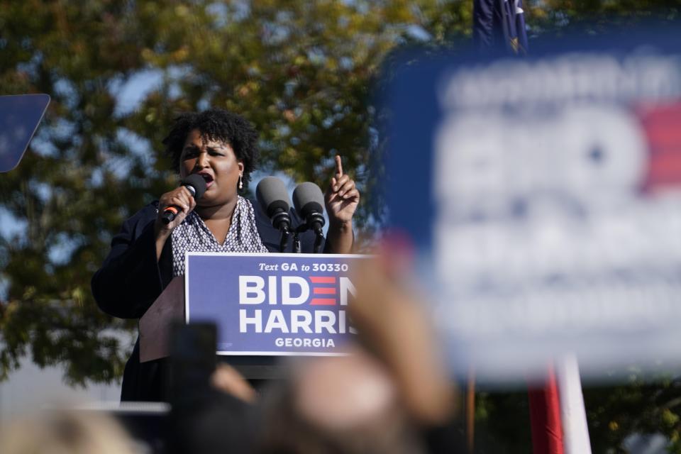 Stacey Abrams speaks to supporters as they wait for former President Barack Obama to arrive and speak at a rally for Joe Biden prior to the 2020 election.