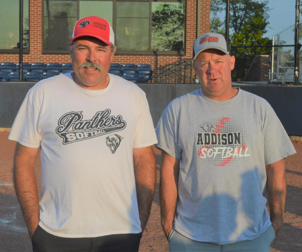 Addison co-head coaches Kelly Gahn, left, and Justin Patterson stand together at Siena Heights after being named Lenawee County Softball Co-Head Coach of the Year.