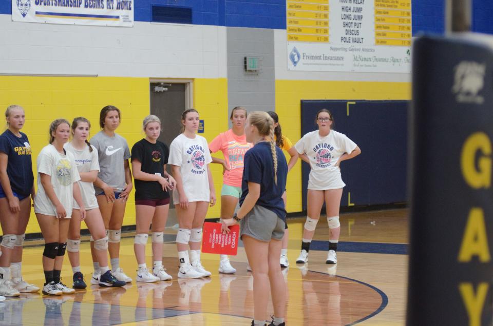 Gaylord varsity volleyball coach Brittany Cornish coaches the players during tryouts on Tuesday, August 8.