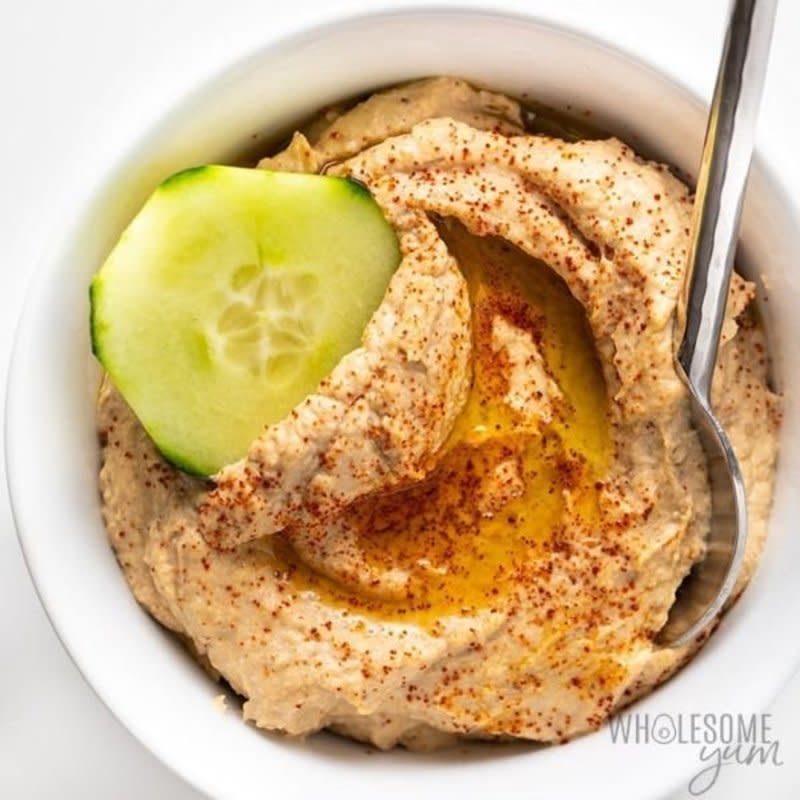 <p>Wholesome Yum</p><p>Full of flavor and the perfect low-carb solution to regular hummus. Serve with veggies for a complete snack.</p><p><strong>Get the recipe:</strong><strong> <a href="https://www.wholesomeyum.com/roasted-cauliflower-hummus-recipe/" rel="nofollow noopener" target="_blank" data-ylk="slk:Keto Paleo Roasted Cauliflower Hummus;elm:context_link;itc:0;sec:content-canvas" class="link ">Keto Paleo Roasted Cauliflower Hummus</a></strong></p>