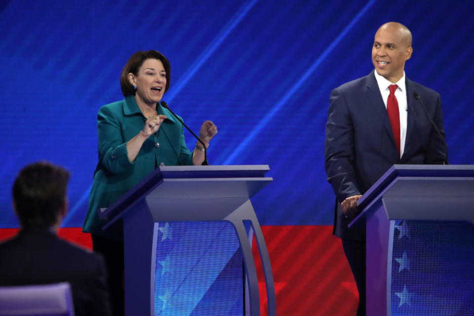 Democratic presidential candidate Sen. Amy Klobuchar speaks as Sen. Cory Booker looks on during the Democratic Presidential Debate at Texas Southern University's Health and PE Center on September 12, 2019 in Houston, Texas. | Win McNamee—Getty Images