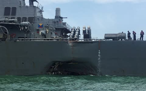 Damage on the US Navy guided-missile destroyer USS John S. McCain after a collision - Credit: Reuters