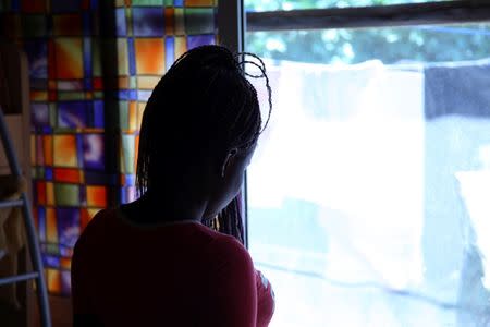 Nigerian ex-prostitute "Beauty" (a pseudonym), poses in a social support centre for trafficked girls near Catania in Italy September 14, 2016. Picture taken September 14, 2016. REUTERS/Tom Esslemont