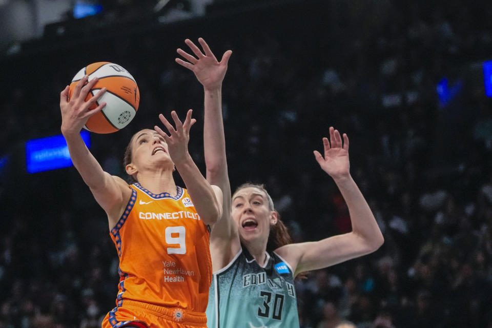 Connecticut Sun guard Rebecca Allen (9) goes to the basket against New York Liberty forward Breanna Stewart (30) during the first half of Game 2 of a WNBA basketball playoffs semifinal Tuesday, Sept. 26, 2023, in New York. (AP Photo/Mary Altaffer)