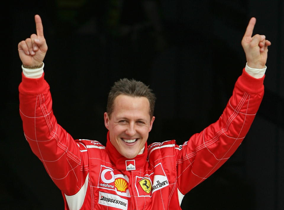 Ferrari Formula One driver Michael Schumacher of Germany celebrates after taking the pole position at the end of the qualifying session for the Bahrain Formula One Grand Prix at the Sakhir racetrack in Manama March 11, 2006. Schumacher and team mate [Brazilian Felipe Massa] will start Sunday's season-opening Bahrain Formula One Grand Prix together on the front row.